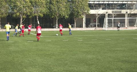 Amateur Soccer Players Engaging in Lively Team Match