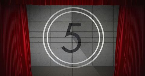 Countdown number 5 on theater screen with red curtains