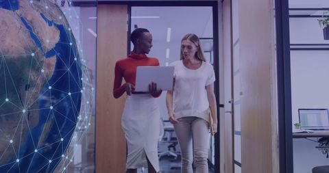 Diverse Professionals Collaborating in Tech-Driven Workspace