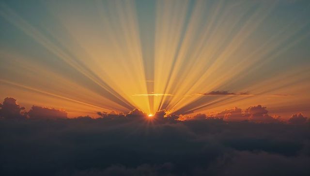 Radiant sunrise over cloud layer with bright horizon glow