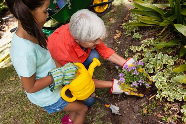 Grandmother and Girl Gardening Together in Backyard - Download Free Stock Photos Pikwizard.com