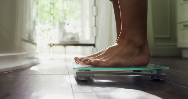 Person Weighing on Digital Scale in Bright Room - Download Free Stock Images Pikwizard.com