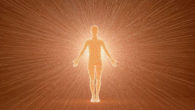 Glowing Human Silhouette Radiating Golden Particles and Light Rays for Energy Technology