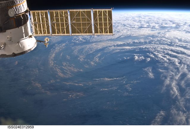 View of Tropical Storm Danielle photographed from the International Space Station on August 30, 2010. Ideal for educational materials focused on atmospheric science, weather phenomena, space exploration, and environmental studies. Can be used in presentations, documentaries, and articles related to space missions and natural disasters.