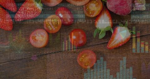 Fresh strawberries and cherry tomatoes with data analytics overlay on rustic wooden table