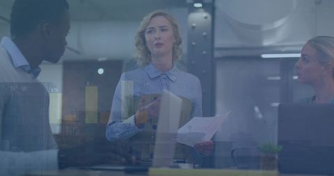 Diverse Professionals Collaborating with Financial Data Visualization