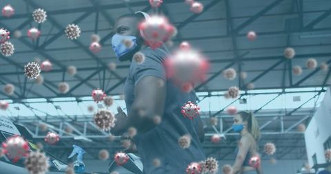 Fitness Enthusiasts Exercising with Overlay of COVID-19 Virus Particles