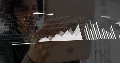 Presenting interactive analytics dashboard with data charts overlay on laptop screen in office