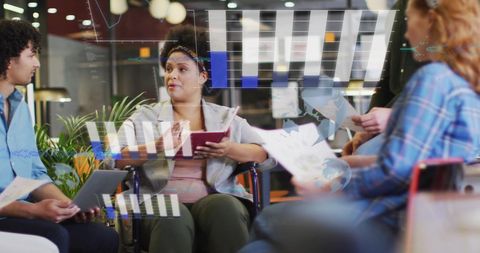 Diverse Team Engages in Data-Driven Business Meeting for Financial Success