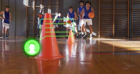 Athletic Men Practicing Soccer Skills in Gymnasium