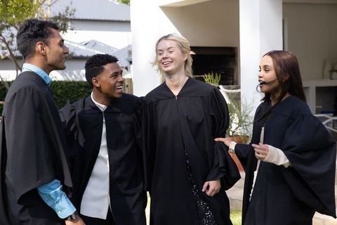 Diverse Friends Celebrating Graduation with Sunny Joyful Gathering