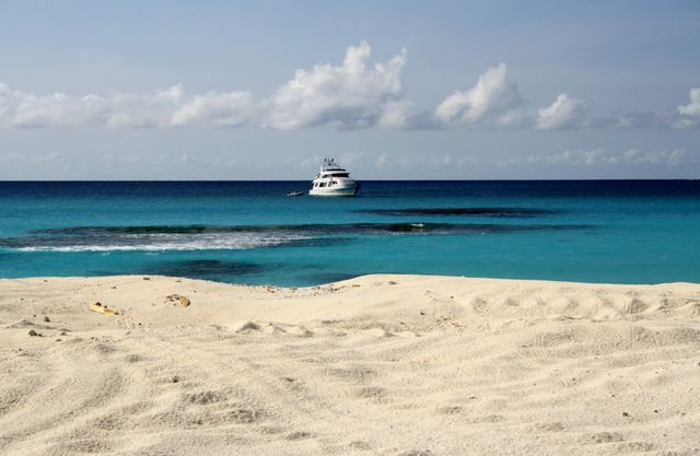Luxury Yacht Anchored off Beautiful Sandy Beach and Turquoise Waters - Download Free Stock Photos Pikwizard.com
