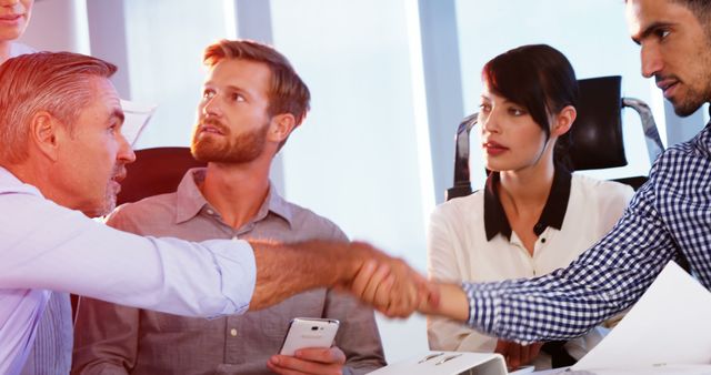 Diverse Colleagues Shaking Hands in Business Meeting - Download Free Stock Images Pikwizard.com