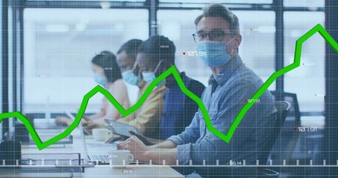 Business Professionals Managing Data in a Pandemic Office Environment