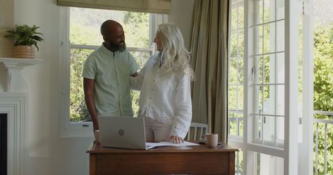 Happy Couple Bonding at Home Office Desk