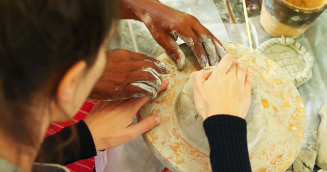 Hands Shaping Pottery Clay on Wheel during Ceramic Class - Download Free Stock Images Pikwizard.com