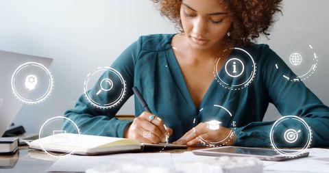 Business Professional Writing Surrounded by Digital Success Icons