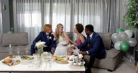 Multiracial Friends Celebrating Wedding Reception at Home