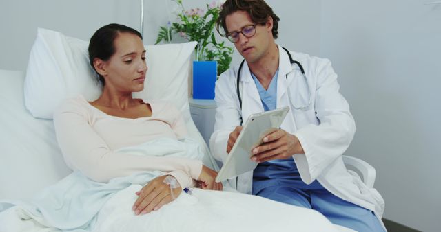 Doctor explaining treatment plan to female patient in hospital - Download Free Stock Images Pikwizard.com