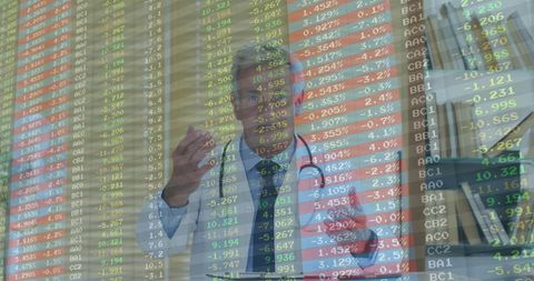 Senior Doctor Analyzing Digital Data in Modern Office