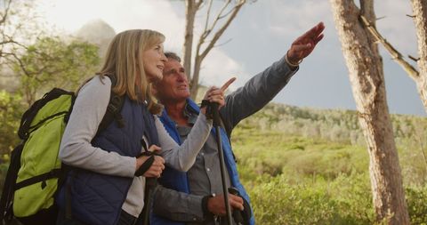 Senior Couple Hiking with Hiking Gear Exploring Nature - Download Free Stock Images Pikwizard.com