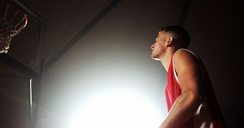 Basketball Player Focused Under Spotlight - Download Free Stock Images Pikwizard.com
