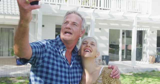 Older couple taking selfie together outdoors - Download Free Stock Images Pikwizard.com