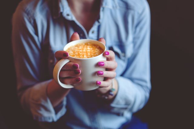 Woman Holding Warm Cup of Coffee with Both Hands - Download Free Stock Photos Pikwizard.com