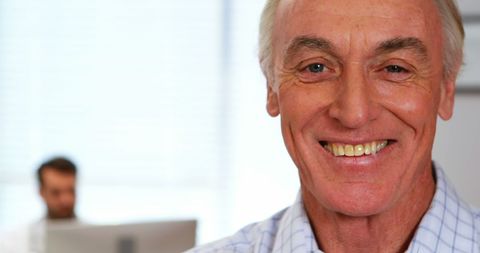 Confident Senior Man in Office Setting Smiling - Download Free Stock Images Pikwizard.com
