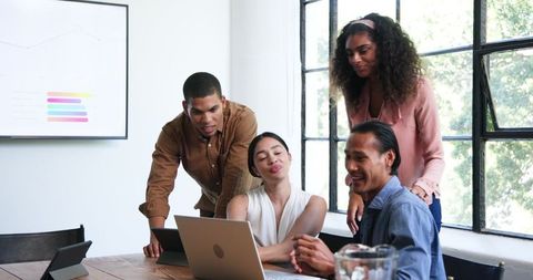 Diverse Team Engaging in Productive Office Meeting Celebration
