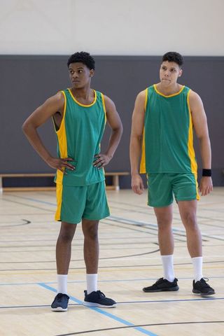 Diverse Male Basketball Teammates Standing on Indoor Court