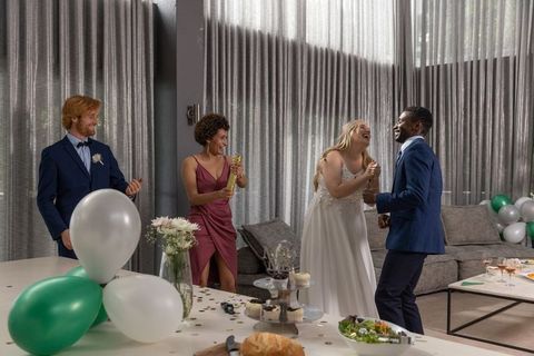 Joyful Wedding Celebration with Dancing Guests in Luxury Venue