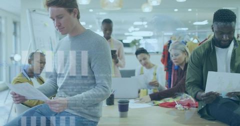 Creative Team Collaborating in Fashion Design Workspace