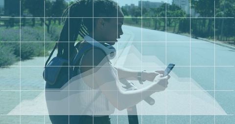 Young Woman Using Smartphone for Navigation and Connectivity