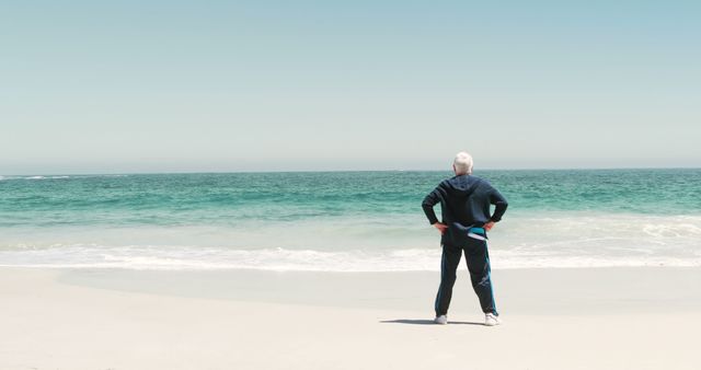 Senior Man Standing on Beach Gazing at Ocean - Download Free Stock Images Pikwizard.com