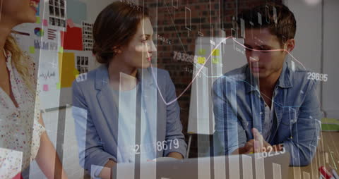 Young Professionals Analyzing Financial Data in Office Setting