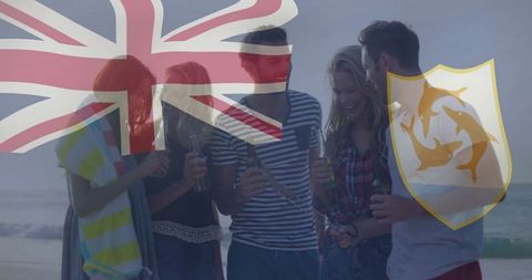 Friends Enjoying Beach Sunset with Union Jack and Dolphin Shield Overlay