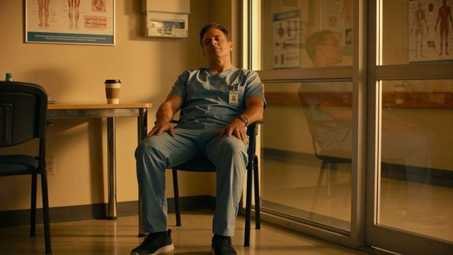 Overworked nurse slumping in clinic break room resting in scrubs with coffee and id badge
