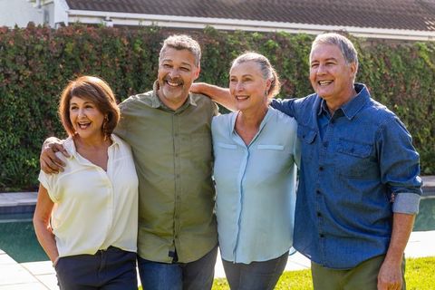 Senior Friends Embracing Joy and Friendship Outdoors