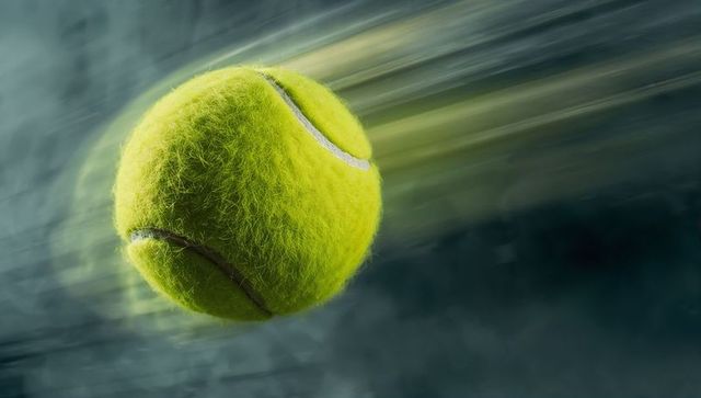 High-Speed Tennis Ball Soaring with Motion Blur