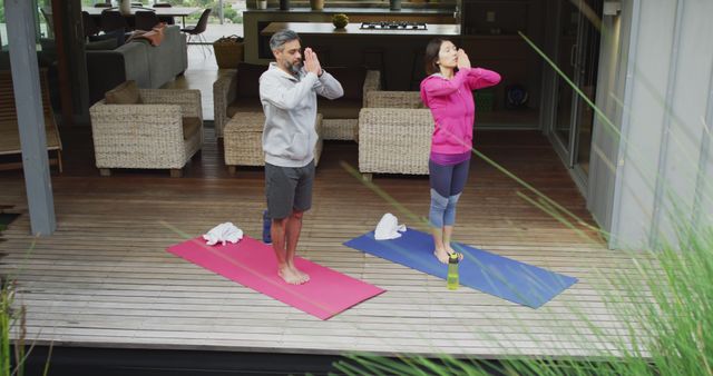 Mature Couple Practicing Yoga Together on Outdoor Deck - Download Free Stock Images Pikwizard.com