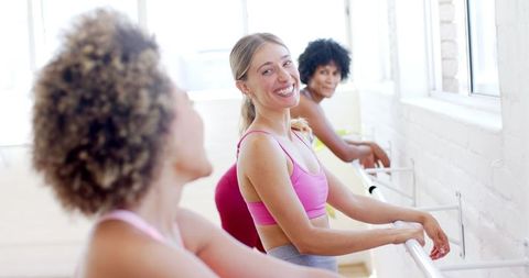 Group of Women Enjoying Pilates Class in Studio