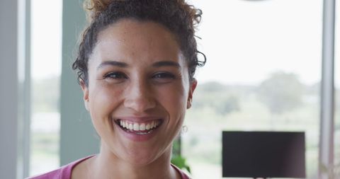Smiling Professional Woman in Bright Office Environment - Download Free Stock Images Pikwizard.com