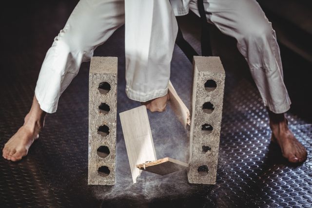 Close-up of karate player breaking a tile