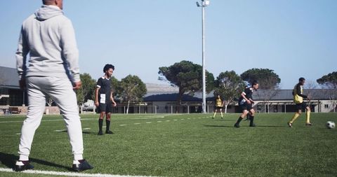 Soccer Coach Observing Practice on Green Field - Download Free Stock Images Pikwizard.com