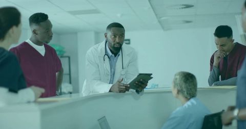 Doctor Leading Medical Team Discussion in Modern Hospital