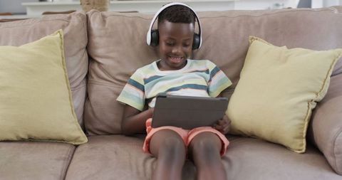 Boy Enjoying Digital Entertainment on Tablet at Home - Download Free Stock Images Pikwizard.com