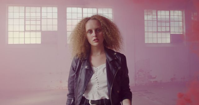 Confident Woman in Leather Jacket Standing in Smoky Abandoned Building - Download Free Stock Images Pikwizard.com