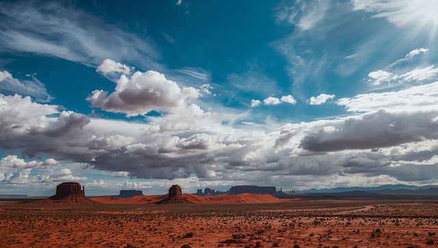 Monument valley style red sandstone buttes under dramatic cloudscape and sun rays, vast desert expan