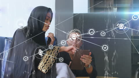 Middle Eastern Businesswoman Exploring Digital Network on Tablet